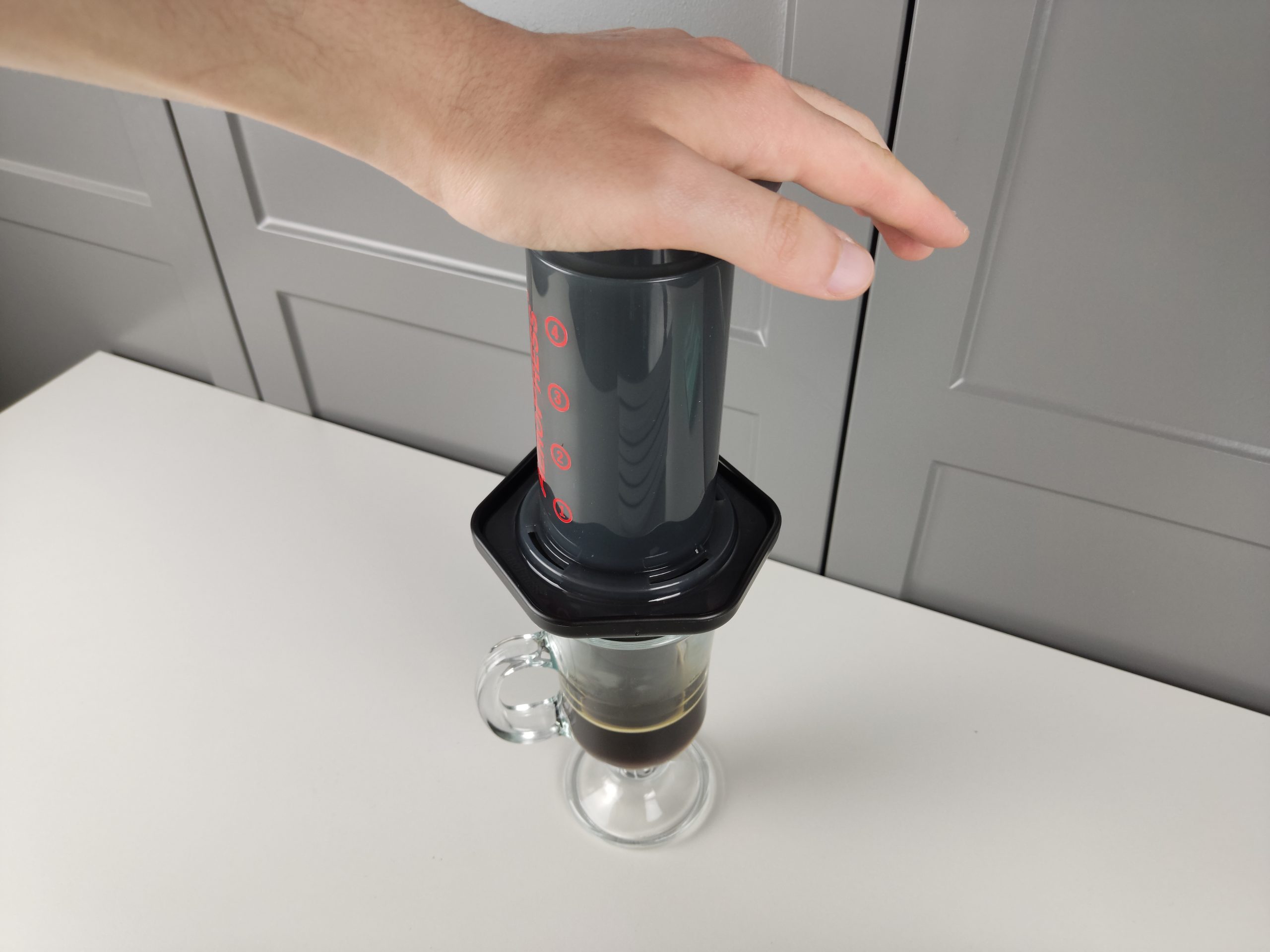 Pressing the plunger of aeropress