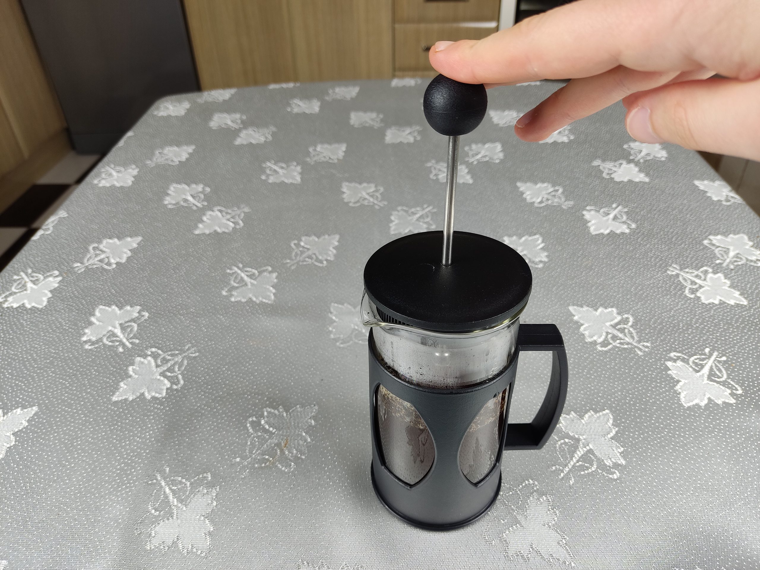 Press the plunger of French Press