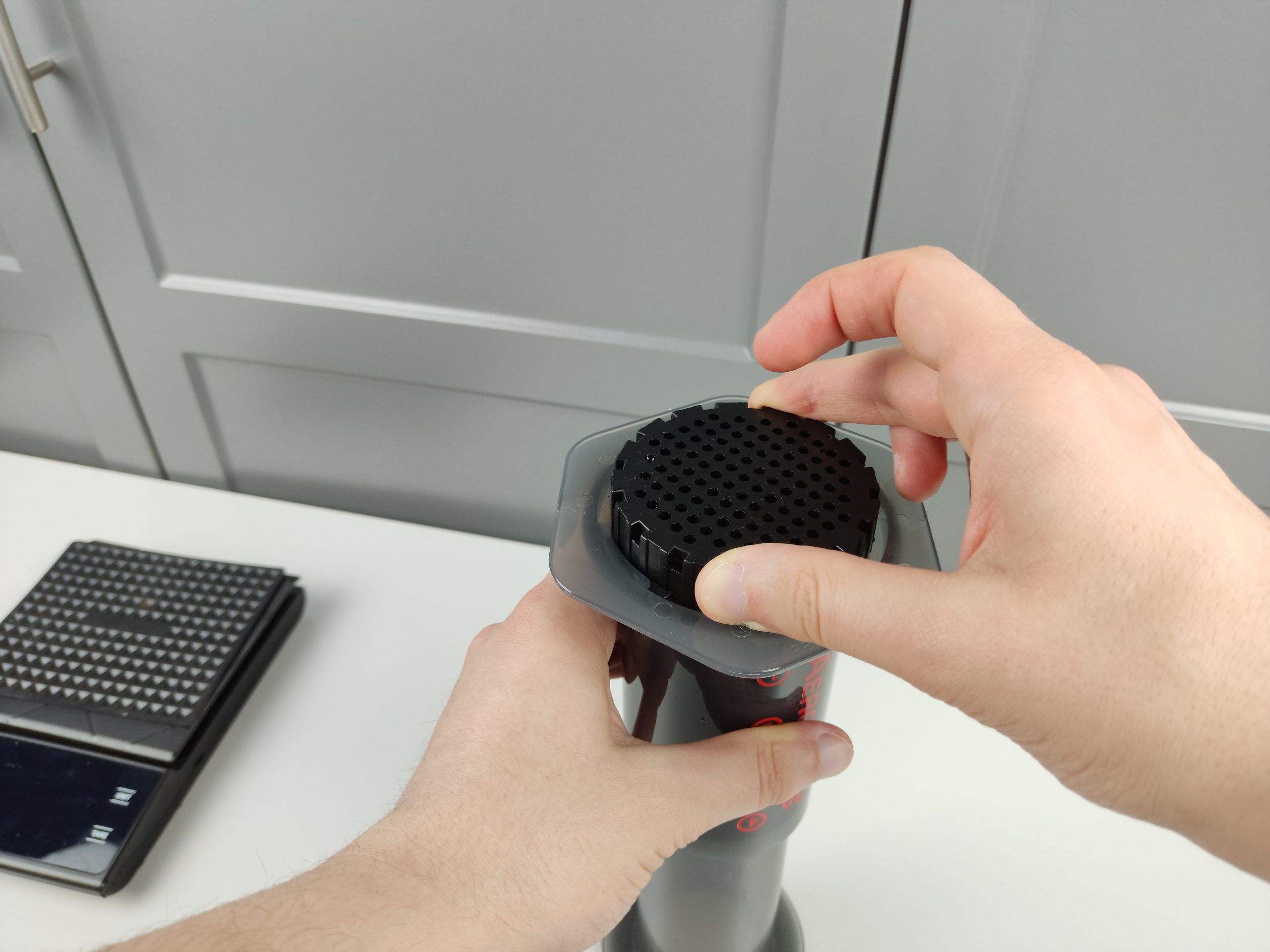 inserting aeropress filter cap